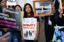 A participant holds a placard that says DHS (Department of Homeland Security) Separates Families dur...