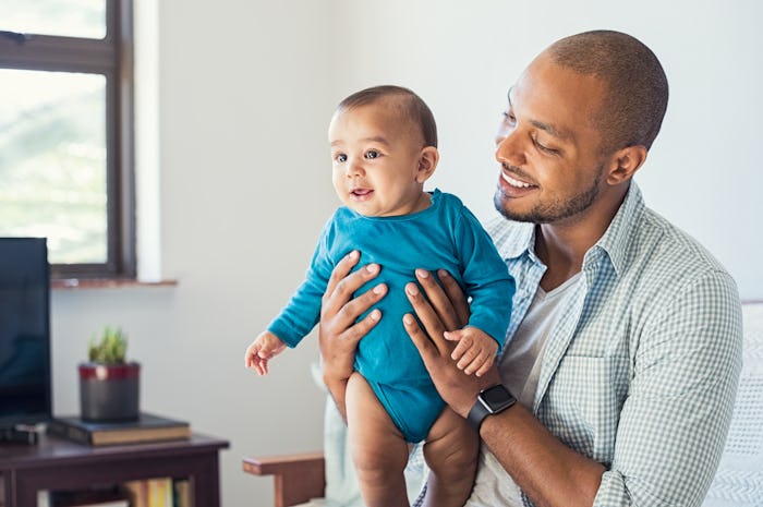 Helping distract baby during a time they'd normally breastfeed is a great way for dads to get involv...