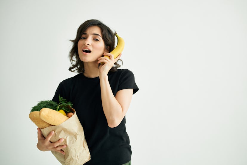   woman with a banana package with food                            