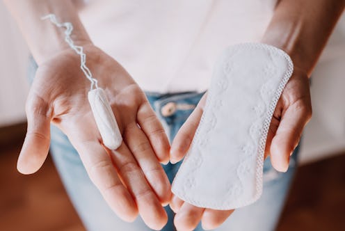 woman holding menstrual pad and tampon, life style. women's health, hygenic