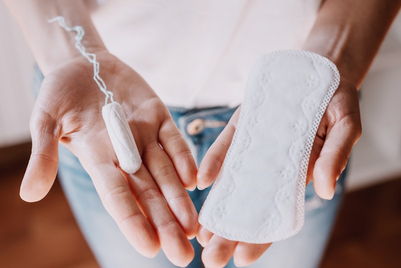 woman holding menstrual pad and tampon, life style. women's health, hygenic 