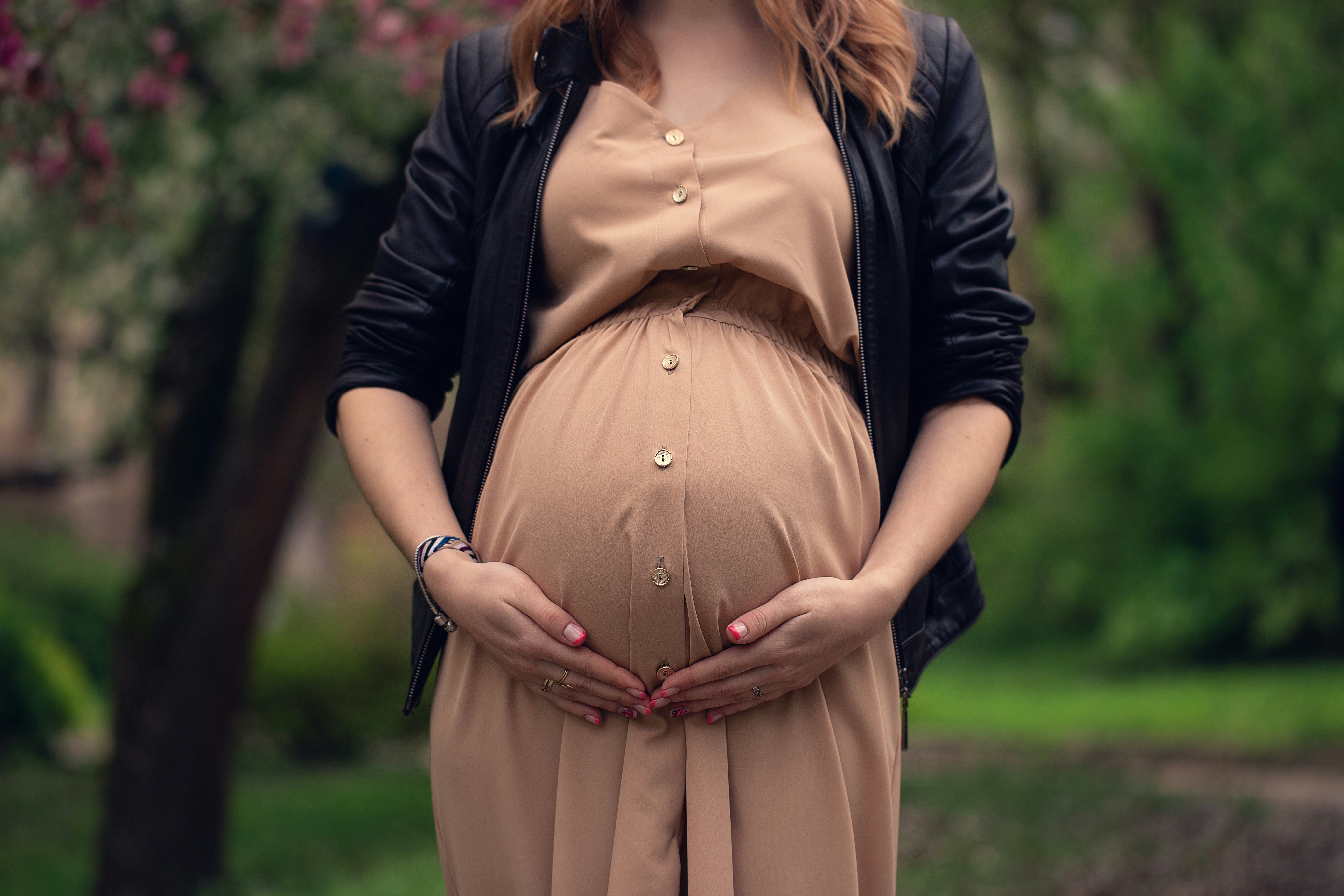 Pregnancy, maternity, romantic photo of a woman. pregnant belly