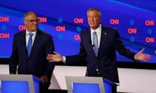 Washington Gov. Jay Inslee listens as New York City Mayor Bill de Blasio speaks during the second of...