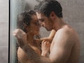 selective focus of sexy man and beautiful woman hugging in shower cabin 