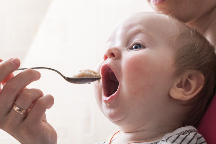 baby feeding spoon of porridge