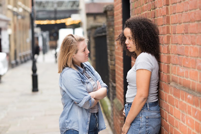 lesbian couple talking in the street