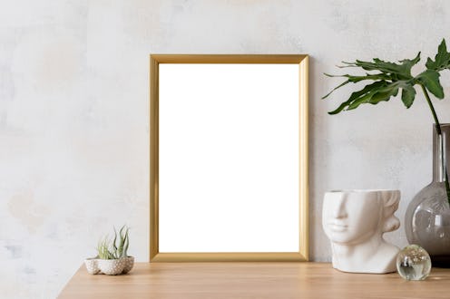 Modern and eclectic room interior with abstract wiped walls, gold mock up frame head sculpture, air ...