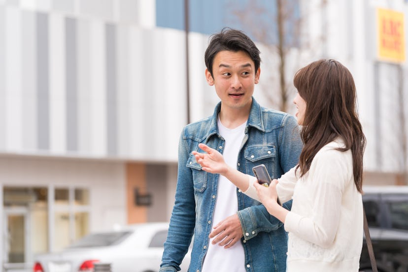 japanese couple talking on the street