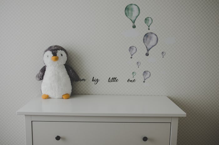 baby nursery with penguin toy