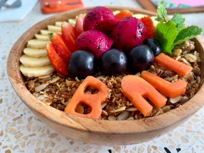 Acai smoothie bowl with bali written in fruit. Indonesian vacation food.