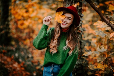 Outdoor autumn portrait of beautiful girl /model /fashion blogger/travel blogger smiling with long h...