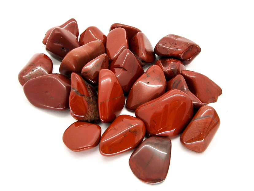 Red Jasper polished tumblestones isolated on a white background