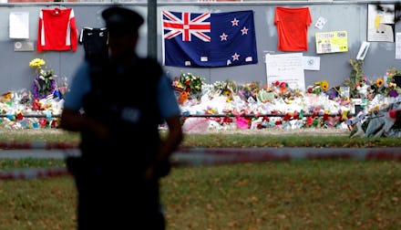 A policeman stands guard near the Al Noor mosque during Friday prayers at Hagley Park in Christchurc...