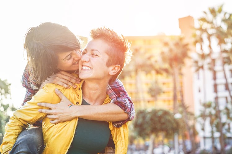 Happy gay couple having fun together outdoor - Young millennials women having a date - Equality righ...