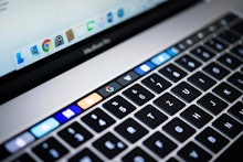 Backlit keyboard and Touch Bar showing websites, laptop, Apple MacBook Pro, close-up
