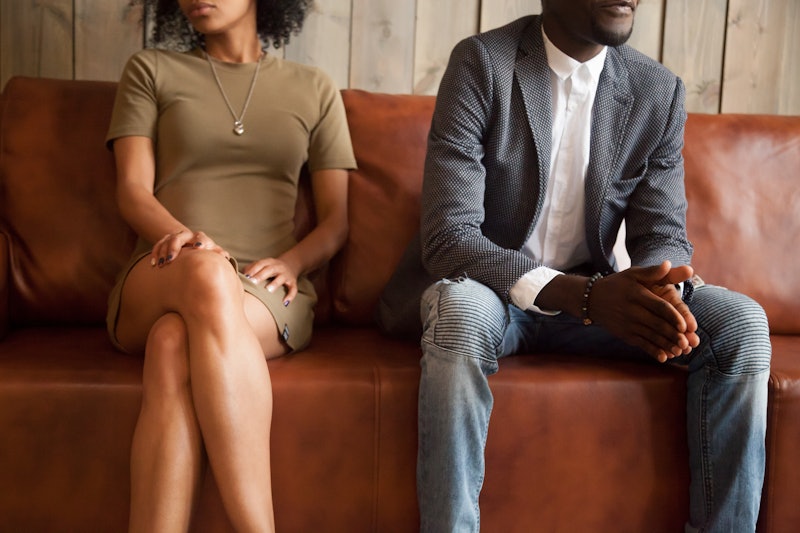 African american unhappy couple sitting on couch after quarrel fight thinking of break up or divorce...