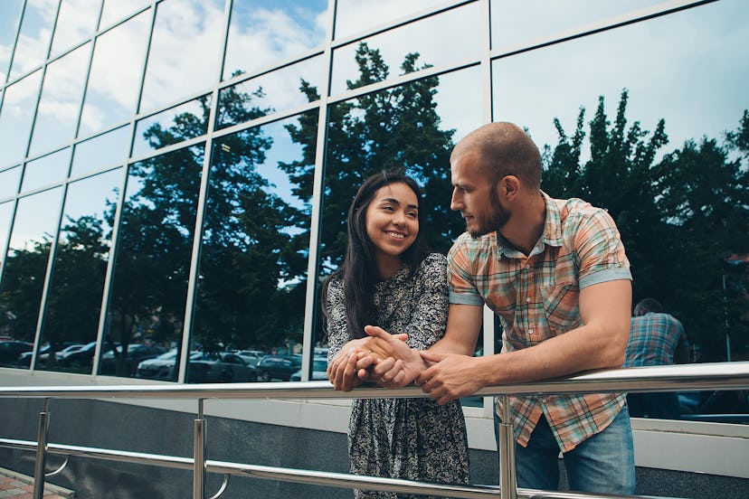 A couple on a date in the city a Man admires a woman on a walk. The concept of family Day, Valentine...