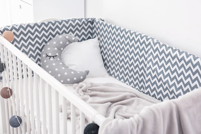 Comfortable crib in baby room. Idea for interior design
