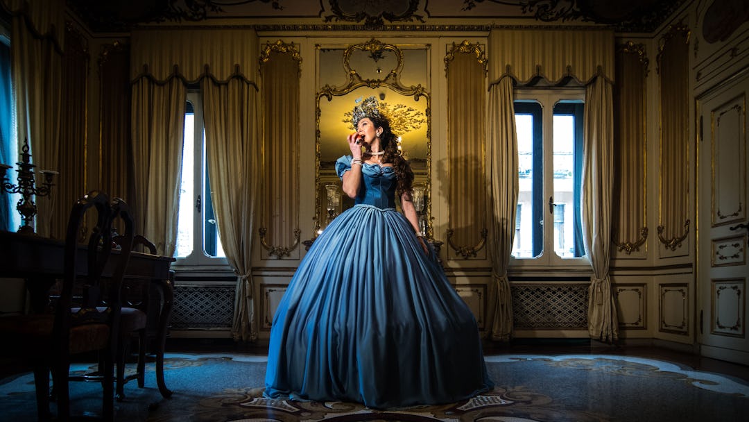 A model poses at the hystorical Ca' Nigra Palace, wearing a Cinderella costume of the 1800s made wit...