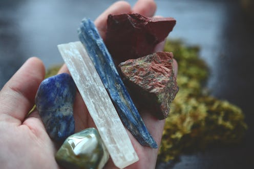 Assortment of healing crystals, like selenite, blue kyanite, red jasper, unakite, and sodalite! Macr...