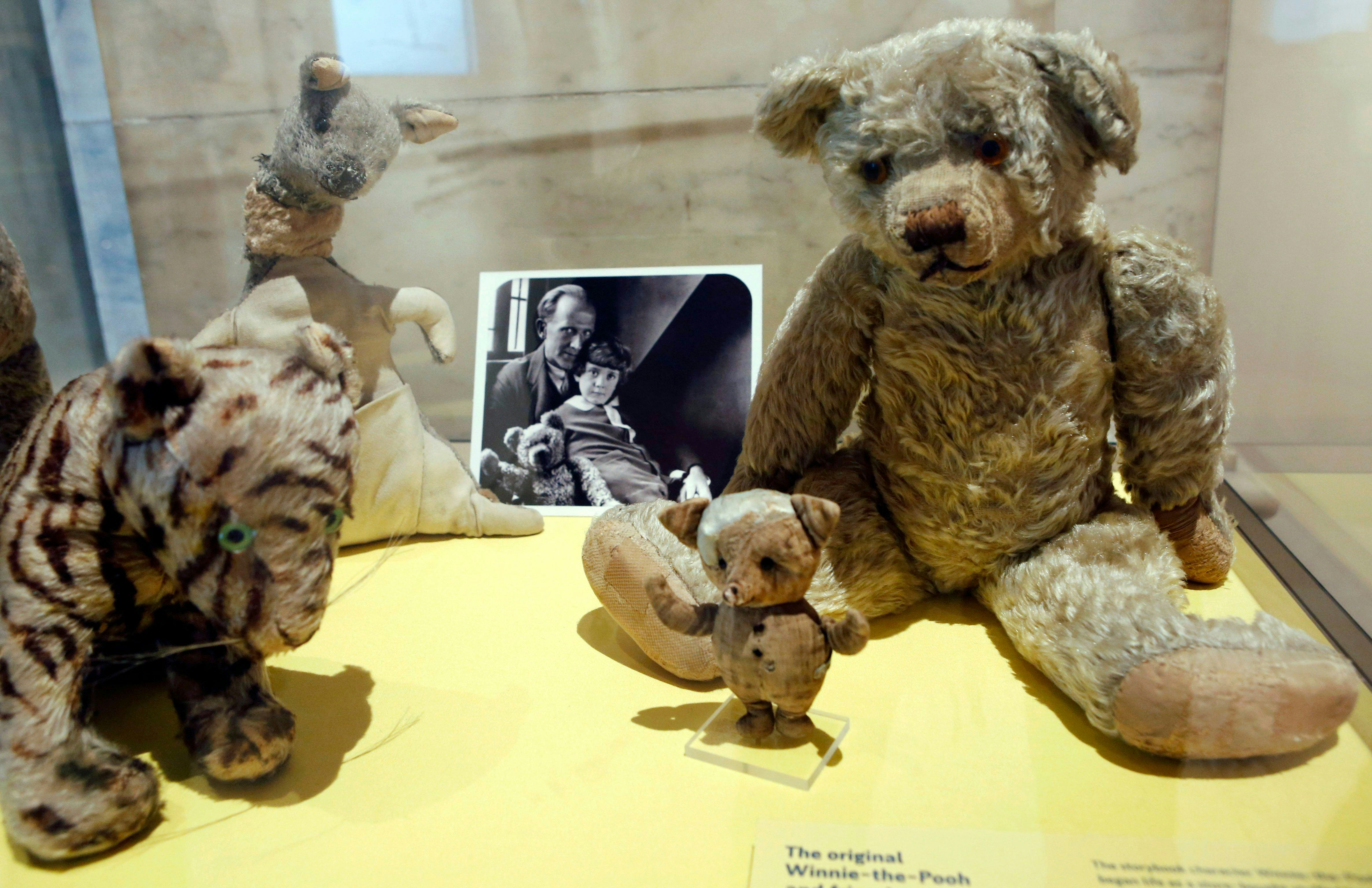 A. A. Milne, Christopher Robin A photograph of author A. A. Milne with his son Christopher Robin is ...