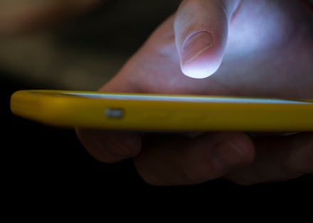 A man uses a cell phone in New Orleans. With suicides on the rise, the government wants to make the ...
