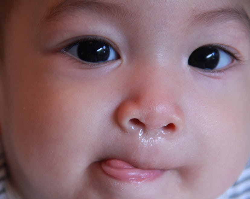 Asian baby boy get a cold or allergy,he has running stuffy nose,red nose.,baby get fever,sore throa...