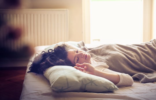 Sleep and beauty. Young sleepy woman in bed. 