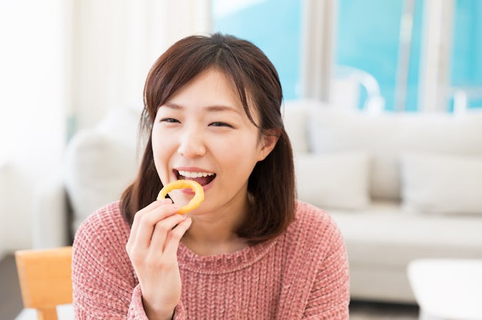 young attractive asian woman who eats