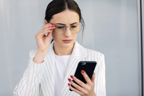 Business Woman Using Phone Near Office