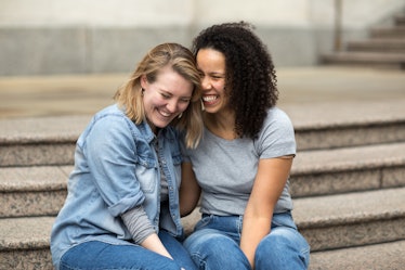 Happy lesbian couple sitting togther