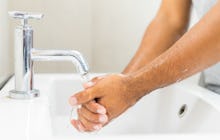 Man washing hands with soap.