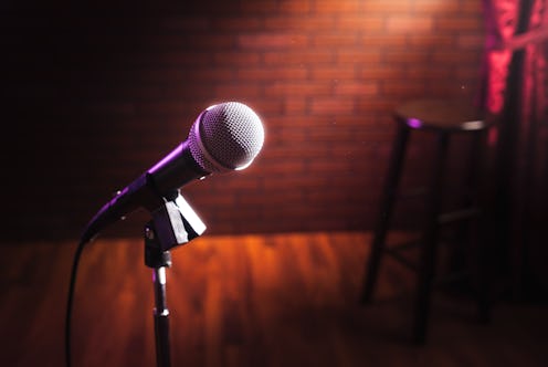 microphone on a stand up comedy stage with reflectors ray, high contrast image