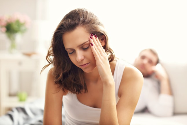 Picture showing young woman and her man having problem in bedroom