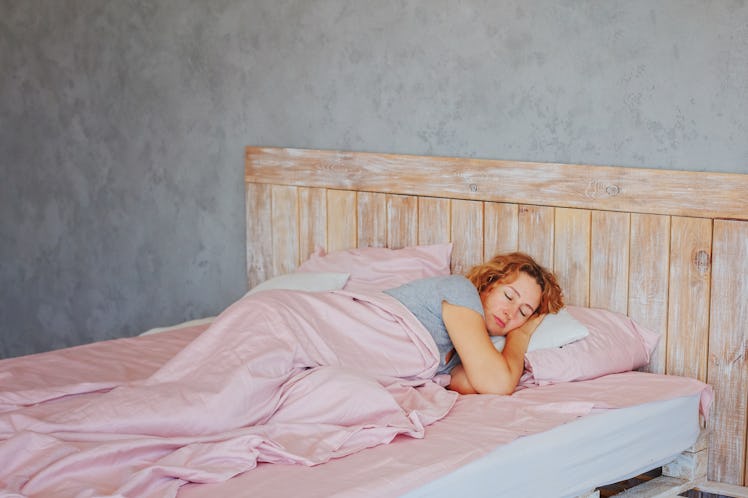 Insomnia in women during menopause / Overwork and early ascents/ Middle-aged woman sleeping asleep i...