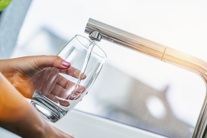 Pouring Fresh Tap Water Into a Glass