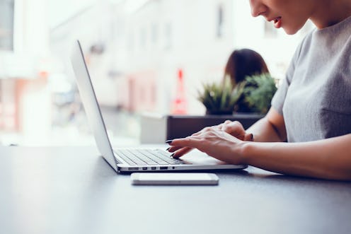 Pretty Young Beauty Woman Using Laptop in cafe, outdoor portrait business woman, hipster style, inte...