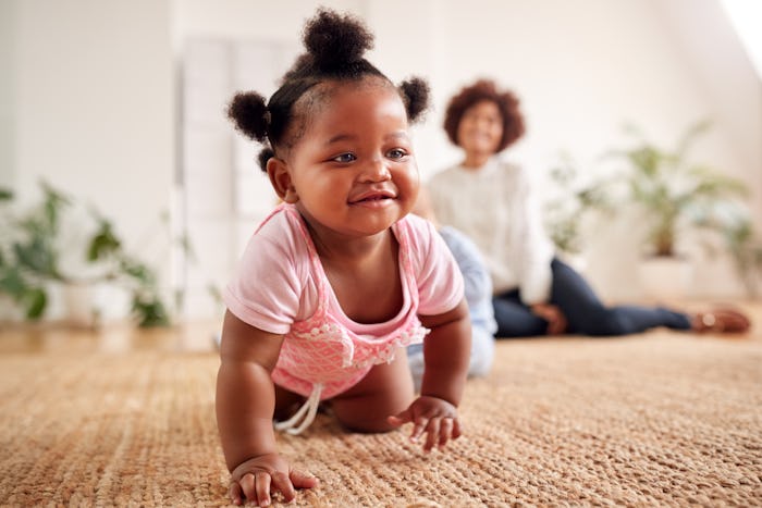 Two Mothers Meeting For Play Date With Babies At Home In Loft Apartment