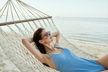 Swimsuit vacation woman hammock sand sea ocean                   