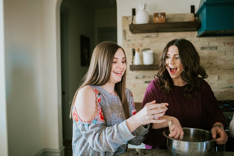 Sisters making cookies together