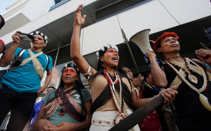 Waoranis leader Nemonte Nenkimo, center, leads a demonstration of Ecuadorian Amazon Indigenous peopl...