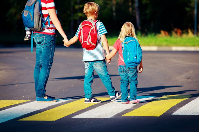 mother taking kids to school or daycare
