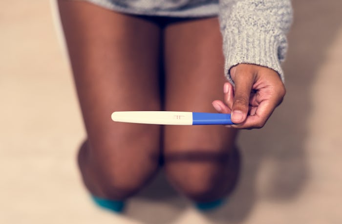 Woman with a pregnancy test