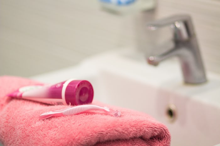 shaving tools : foam, shaver. Safety razor with shaving cream on pink bath towel, shaving procedure ...