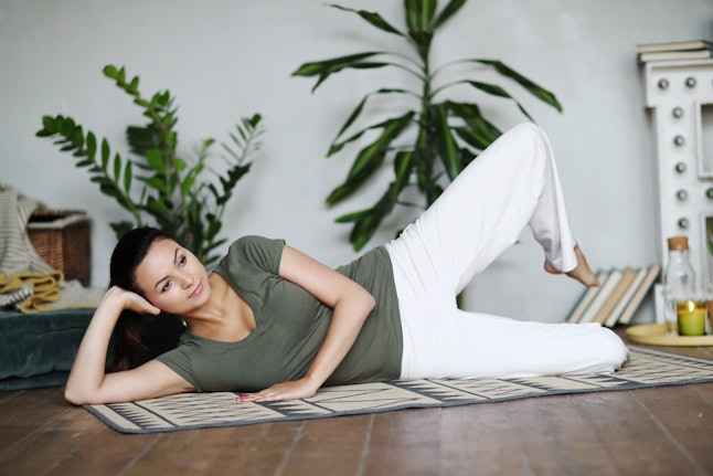 Yoga. Woman doing yoga at home