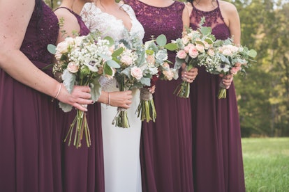 Bride and bridesmaids holding bouquets