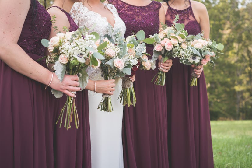 Bride and bridesmaids holding bouquets