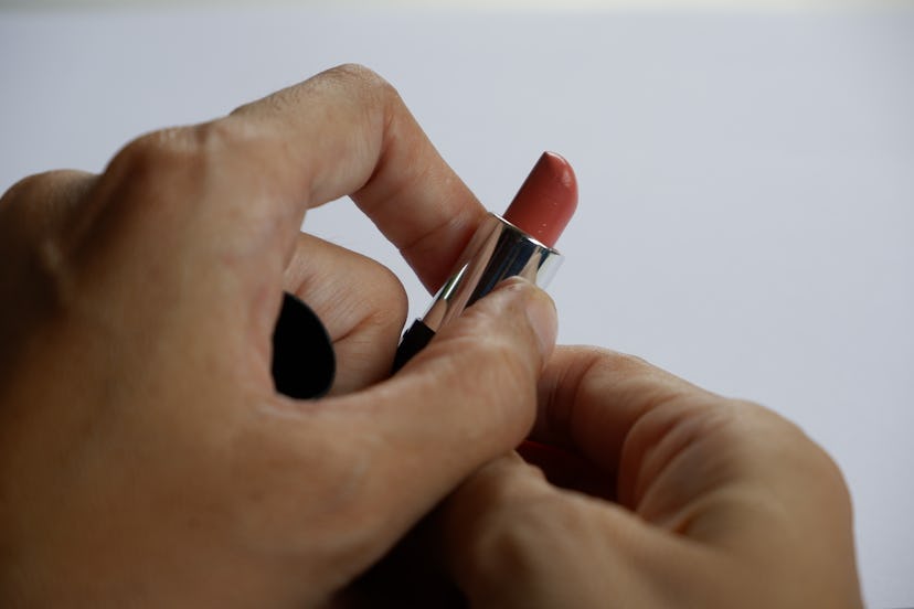 Woman with lipstick on a white background