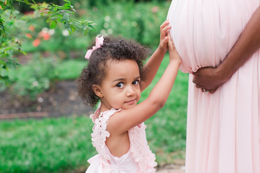 Toddler with pregnant mom.