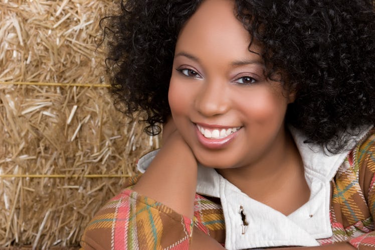 Smiling Woman in Hay